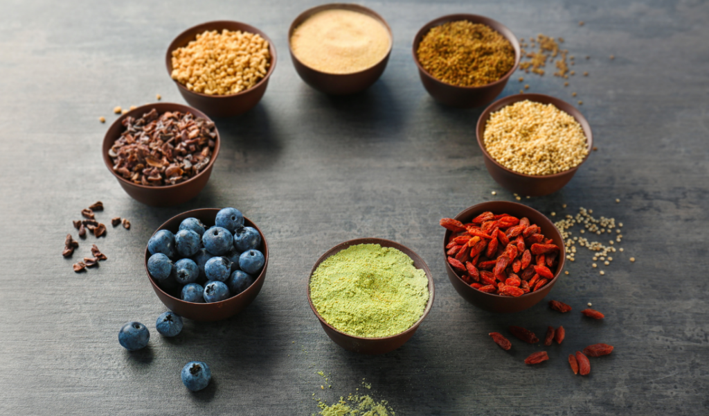 a bowl of colorful superfood powder mix
