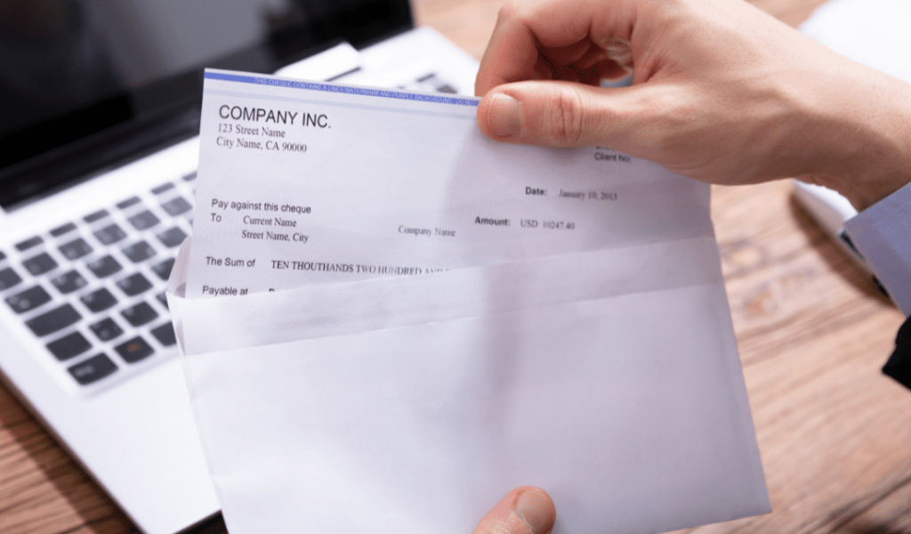 cloud with dollars raining down, laptop with paycheck