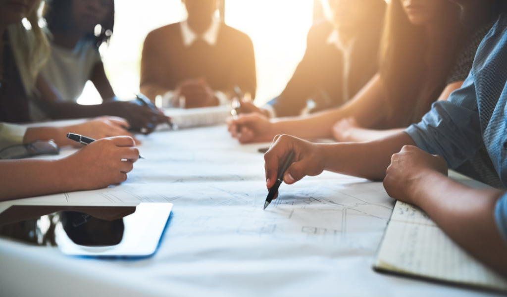 design studio with employees collaborating on design work