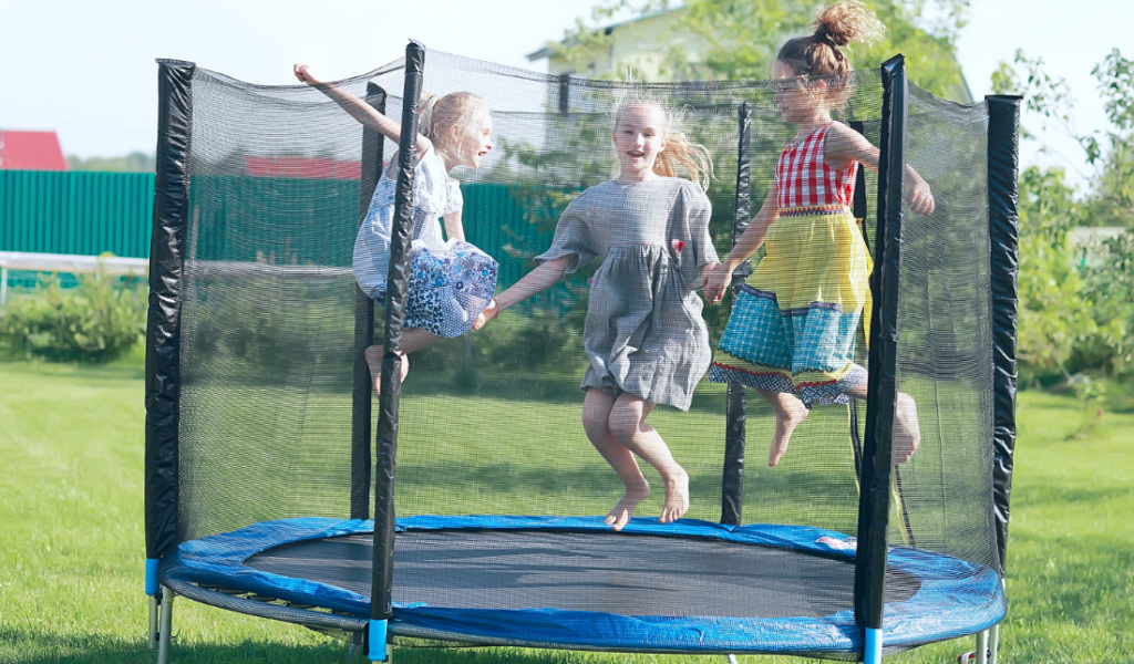 family jumping on a trampoline