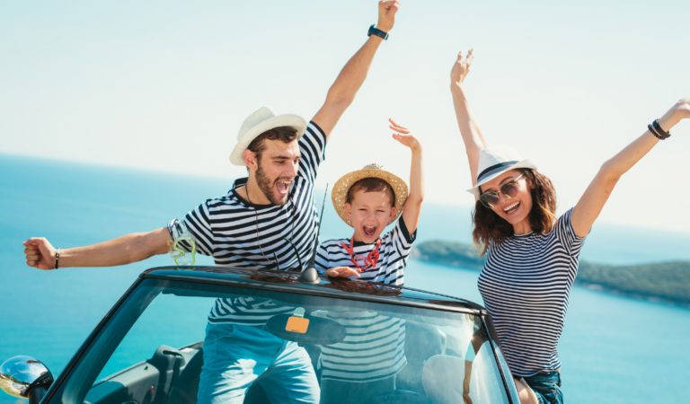 family traveling together with smiling children and parents