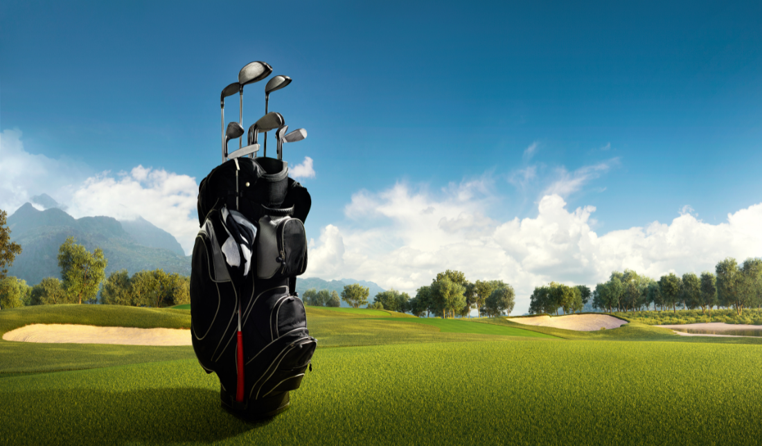 golf course with a customized golf bag in the foreground