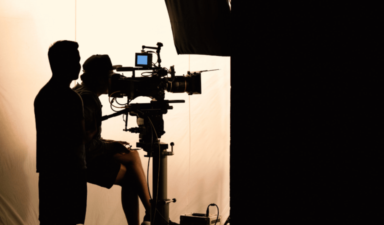 group of diverse professionals working together on a video production set