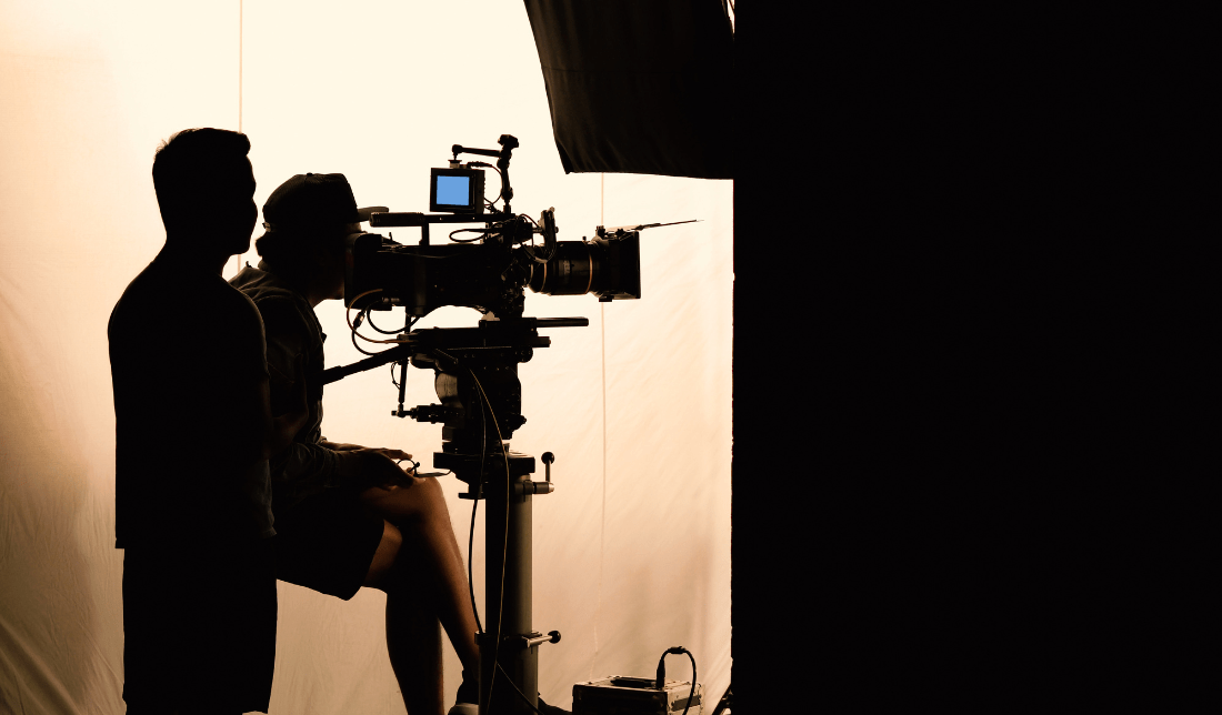 group of diverse professionals working together on a video production set