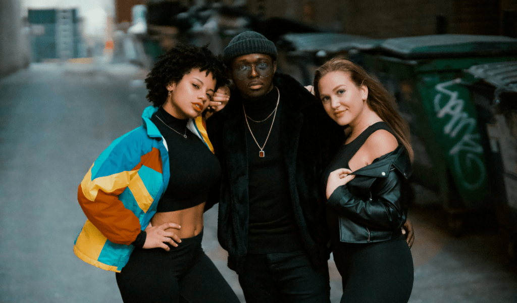 group of fashionable young adults wearing streetwear clothing