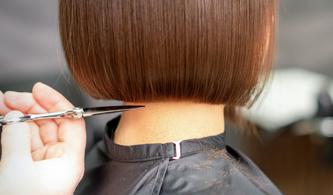 hairstylist cutting hair