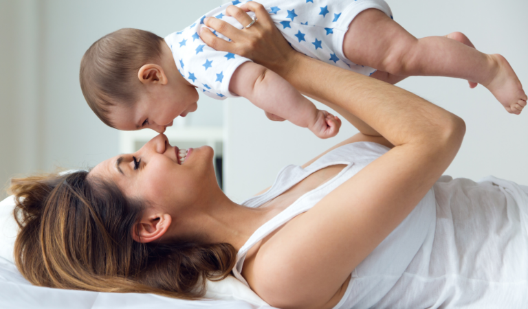 happy mother holding her baby