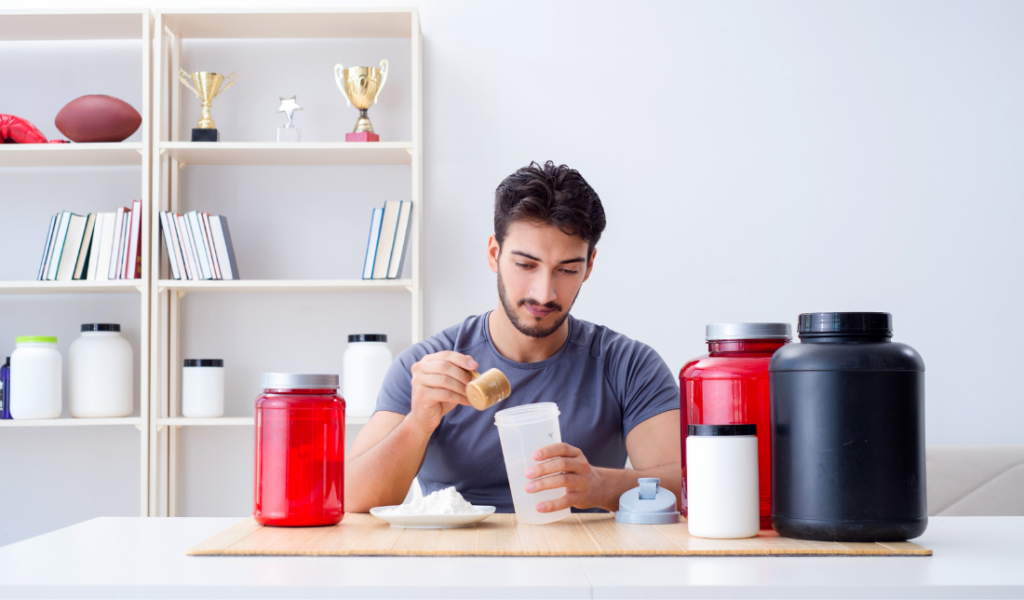 healthy and fit individual standing next to a jar of supplements