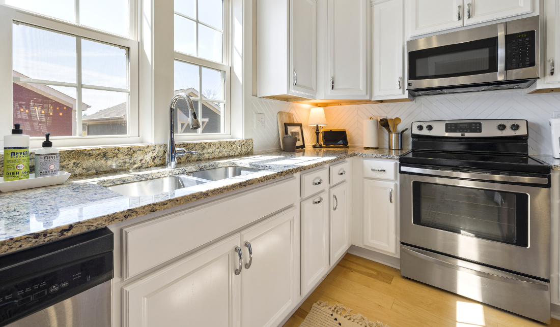 home kitchen with shining appliances, clean countertops