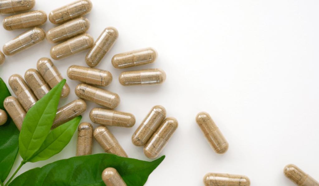 jar of nutritional supplements with a green, leafy background
