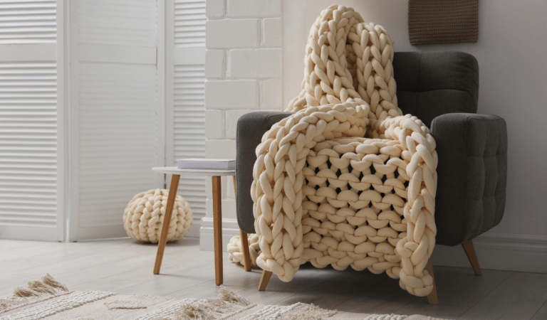 living room with a chunky knit throw blanket