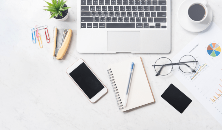office desk filled with stationery and desk accessories