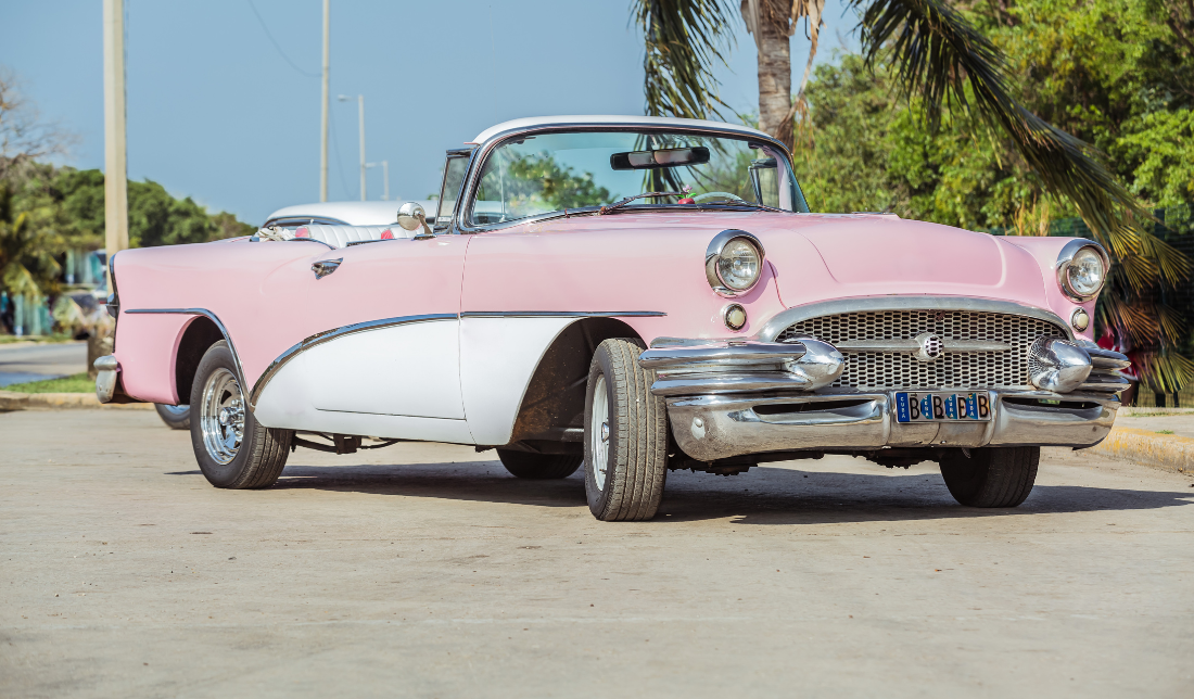 painting, a yacht, a vintage car