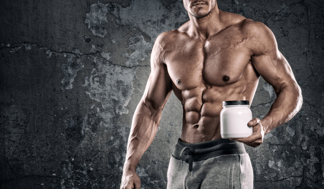 person exercising holding a nutritional supplement bottle