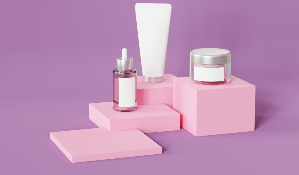 pink and white bottle of face cream