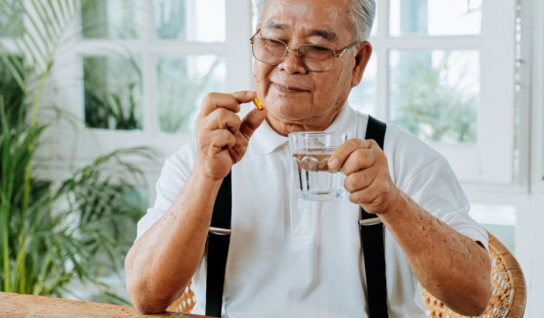 senior taking nutritional supplement
