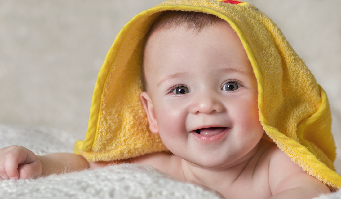 smiling baby or a baby bottle with organic ingredients