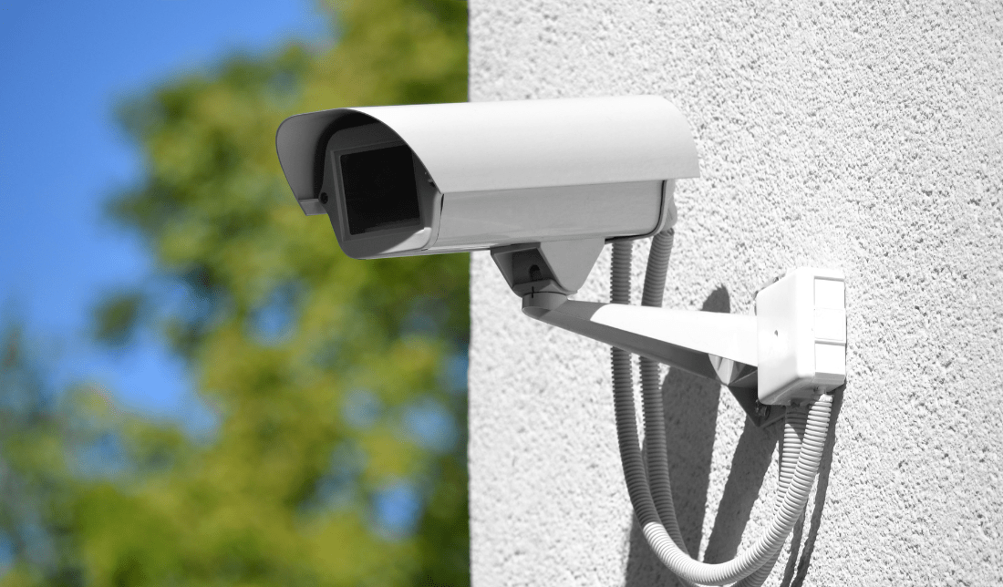 surveillance camera with the business's logo overlaying