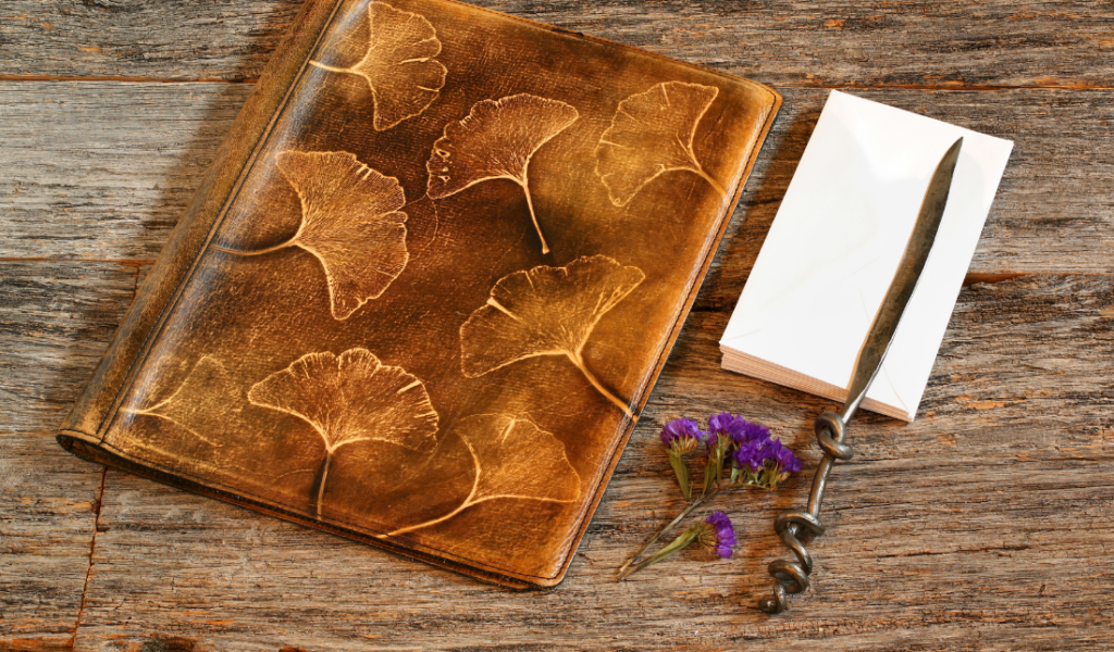 vintage-looking padfolio, bookmark, or bookend