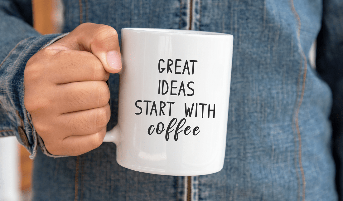 white coffee mug with the brand name printed