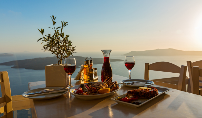 wine bottle with branded candleholders and wine glasses