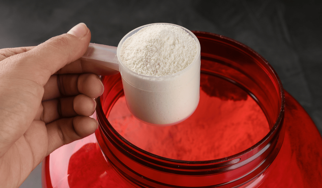 woman holding a jar of natural supplements