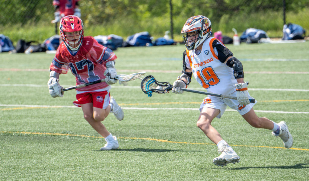 young person wearing stylish sports apparel while holding a sports equipment