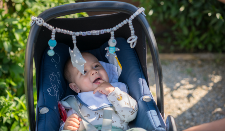 happy baby in a stroller