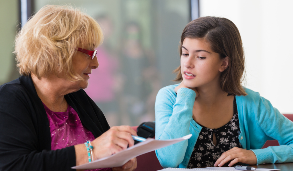 high school student studying with a tutor