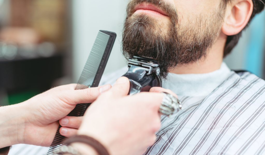 man grooming his beard
