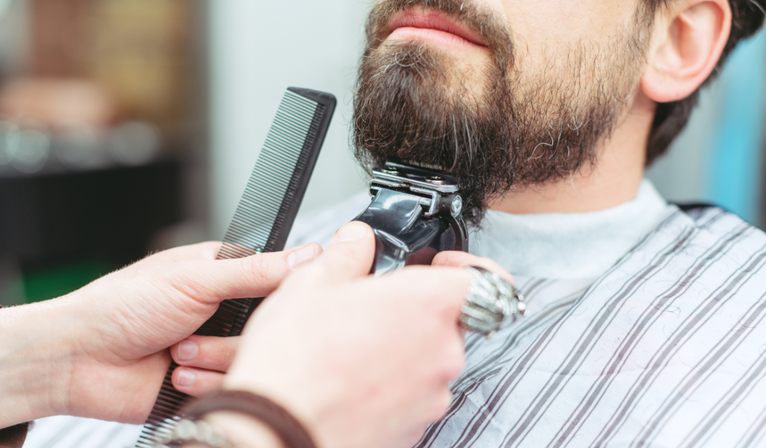 man grooming his beard