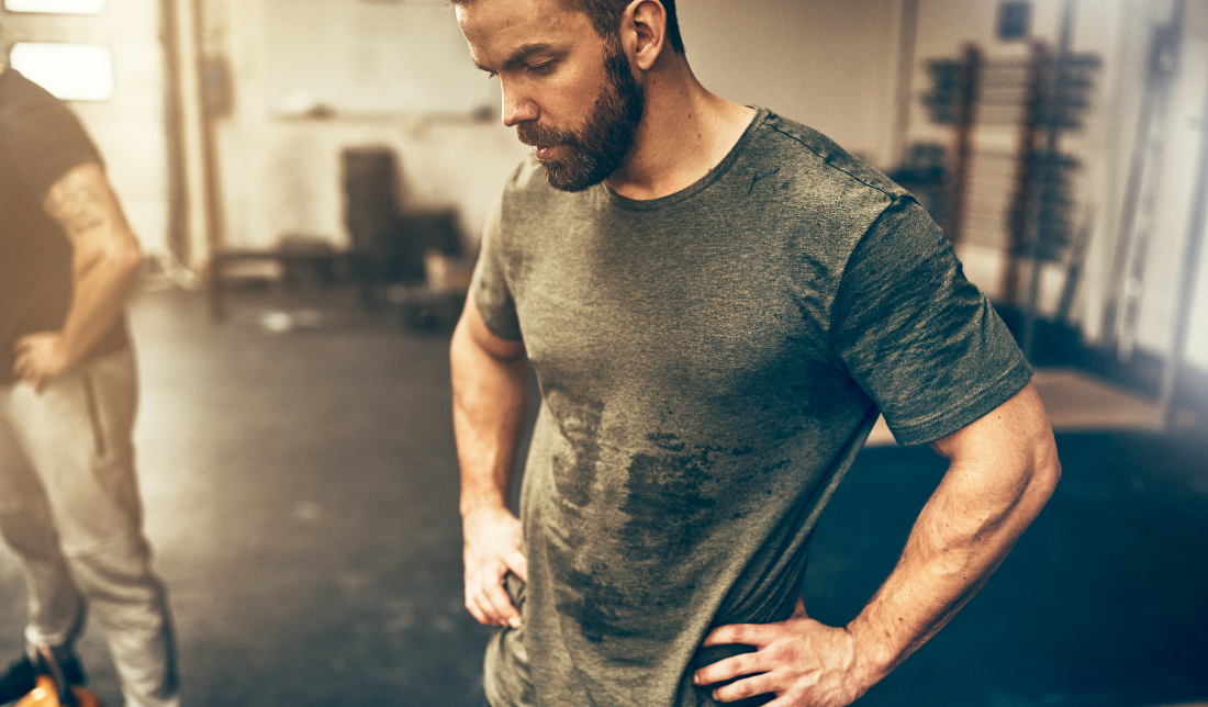 person wearing a sweat-proof undershirt