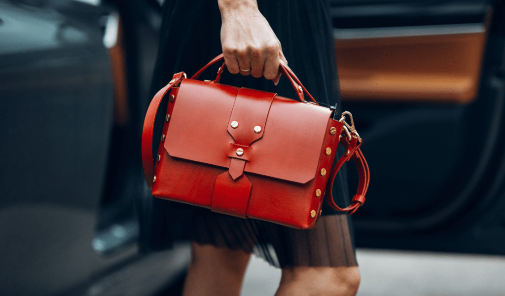 stylish woman holding a designer handbag