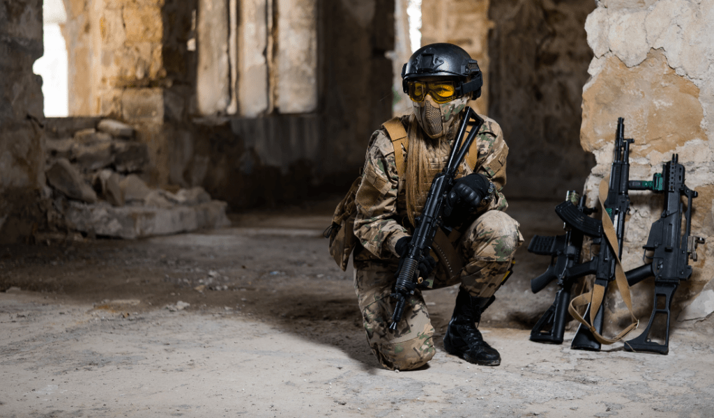 tactical gear, holding a firearm